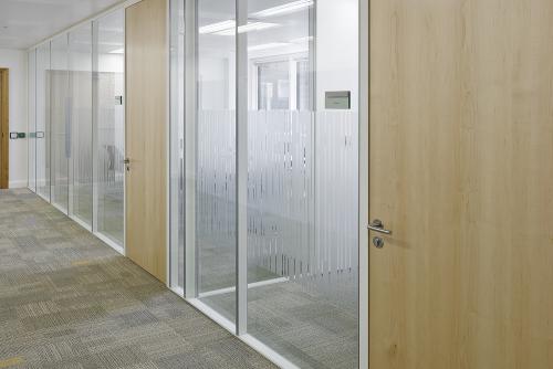 Flush glazed office fronts with timber door